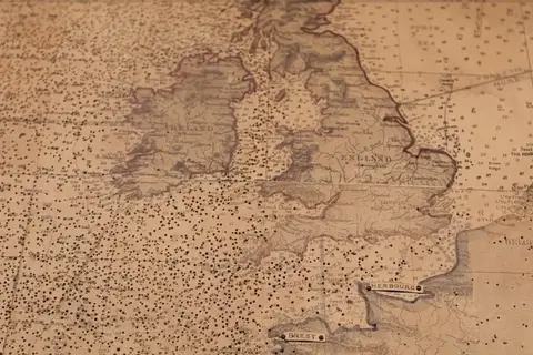 Map: A map from WW2. Every pin prick is the position of a fleet of up to 40 ships!